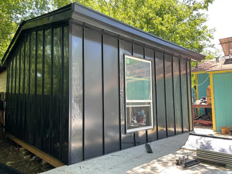 Black standing seam metal wall panels for Roof Inspection in Magna